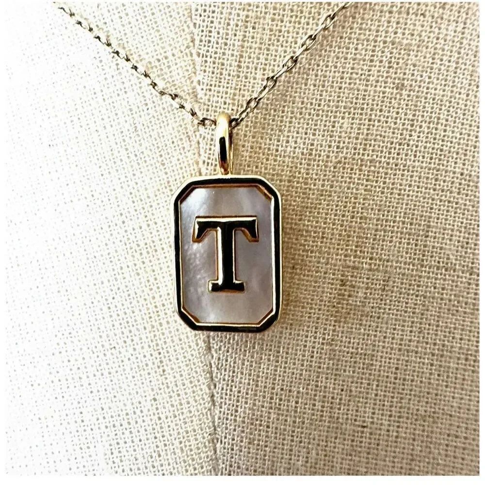 Gold tone and opal T monogram pendant necklace